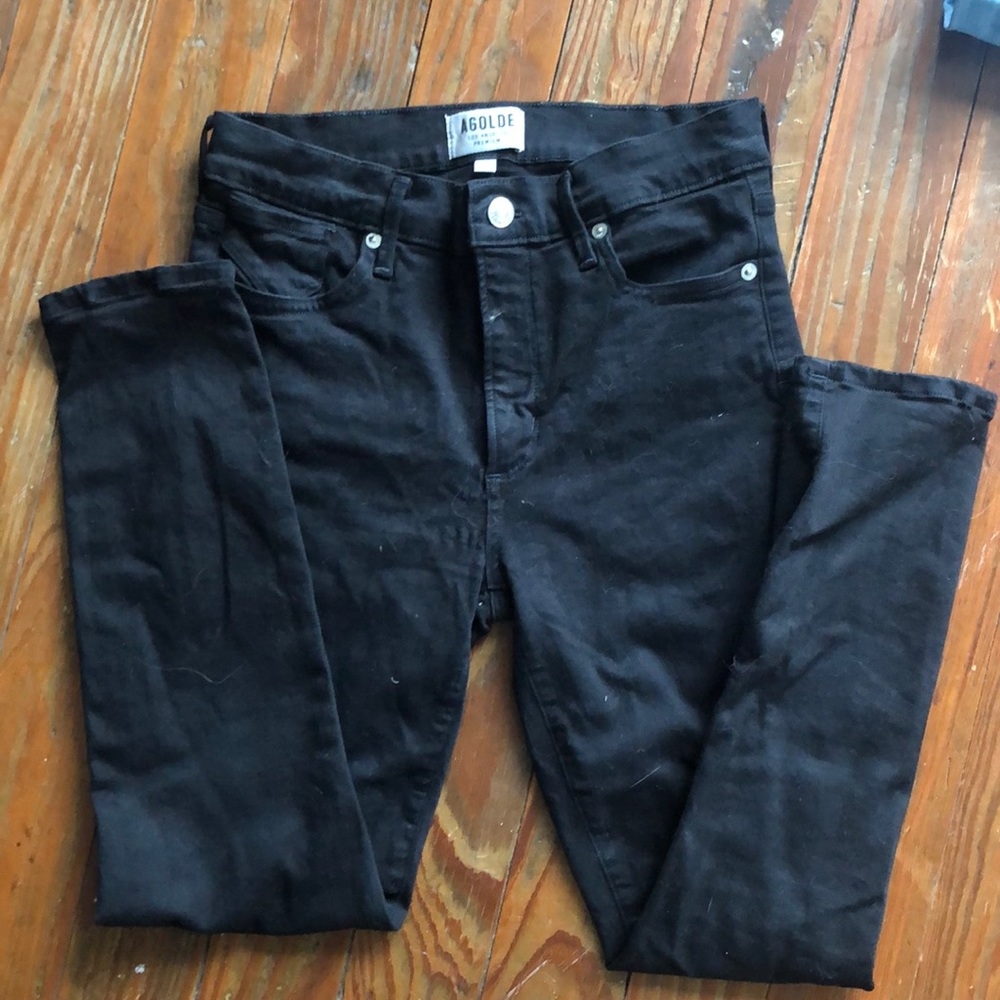 Quality black denim. Some signs of wear.
